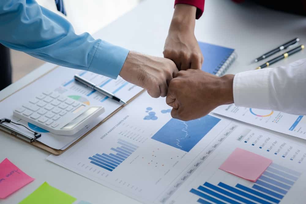 Financial consultants planning corporate mergers and acquisitions