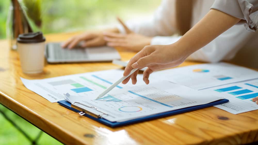 Financial expert preparing feasibility projection report for business expansion
